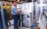 Operators are safely encased in a Rexroth Eco-safe fence system with polycarbonate panels